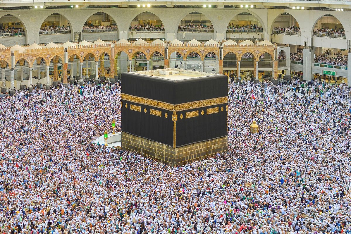 The Kaaba at the centre of the Great Mosque in Makkah, surrounded by pilgrims.
